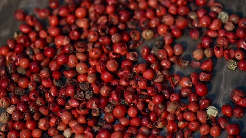 Rustic red Peppercorn on black table Video stock 73365756