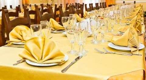 Rustic restaurant table with yellow tablecloth Stock Illustration