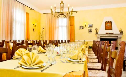 Rustic restaurant table with yellow tablecloth Stock Illustration