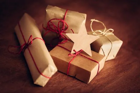 Rustic retro gift, present boxes with tag. Christmas time, eco paper wrap. Stock Photos