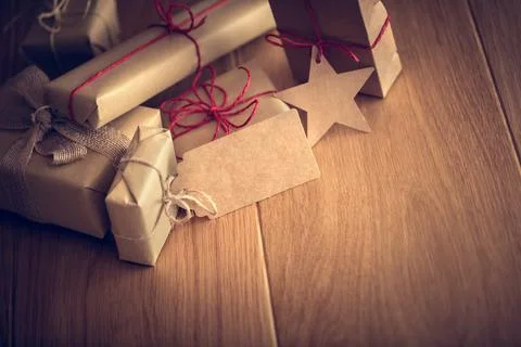 Rustic retro gift, present boxes with tag. Christmas time, eco paper wrap. Stock Photos