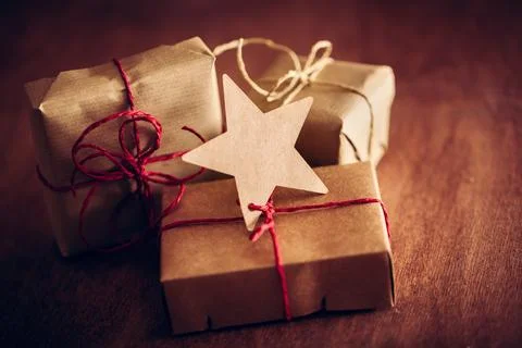 Rustic retro gift, present boxes with tag. Christmas time, eco paper wrap. Stock Photos
