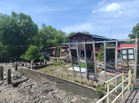 Rustic Riverside Home &amp; Scaffolding Stock Photos