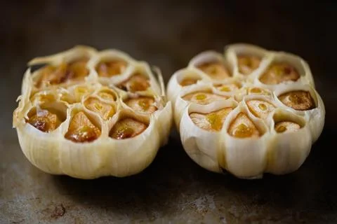 Rustic roasted baked garlic Stock Photos