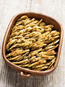Rustic roasted hasselback potato gratin Stock Photos