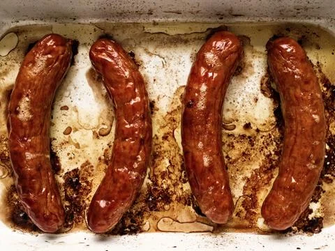 Rustic roasted sausages Stock Photos
