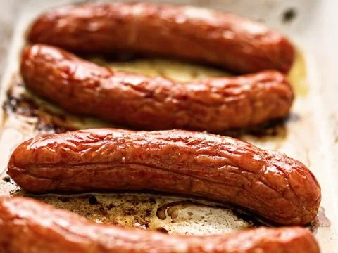 Rustic roasted sausages Stock Photos