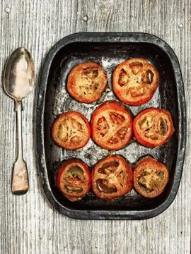 Rustic roasted tomatoes Stock Photos