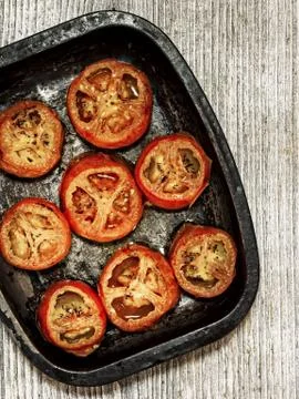 Rustic roasted tomatoes Stock Photos