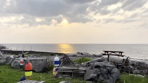 Rustic Rocky Beach Sunset with Ocean Glow and Buoys Video stock 311656895