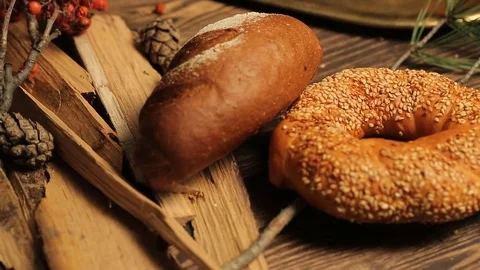 Rustic rolls and breads, with cereals on the table, close up Stock Footage 70676823