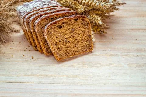 Rustic rye. Fresh loaf of rustic traditional bread with wheat grain ear or sp Stock Photos