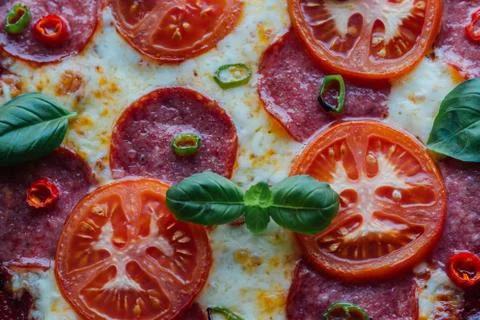 Rustic salami pizza Stock Photos