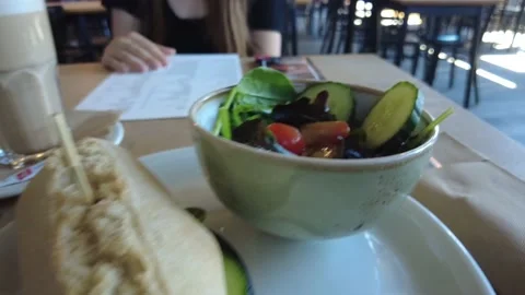Rustic sandwich with a fresh salad and a cafe latte Stock Footage 228944977