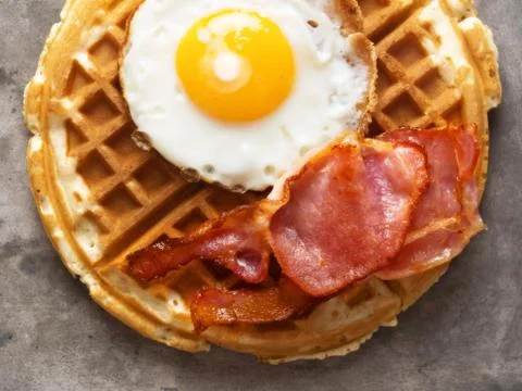 Rustic savory bacon and egg waffle Stock Photos