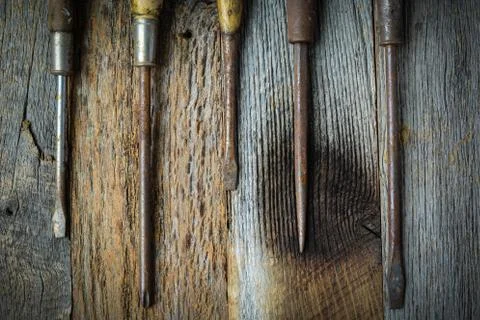 Rustic screwdrivers on wood background Stock Photos