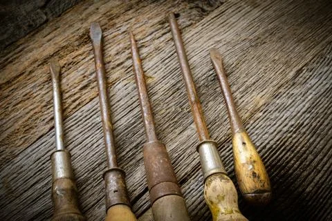 Rustic screwdrivers on wood background Stock Photos