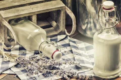 Rustic setting with fresh milk bottles Stock Photos