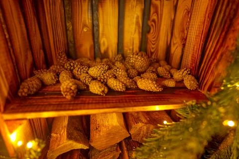 Rustic Shelf with Pine Cones and Logs Stock Photos