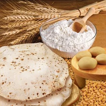 Rustic shot of a plate of chapati surrounded by ingredients Stock Photos