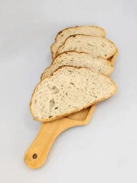 Rustic Sliced Bread on Wooden Board 库存照片