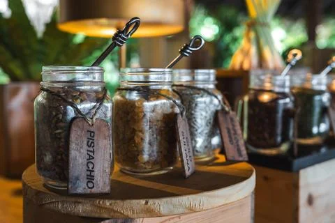 Rustic snack station with glass jars of nuts at Maldives resort Fotos de archivo