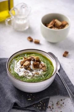 Rustic spinach and broccoli rich soup puree with cream and croutons Stock Photos