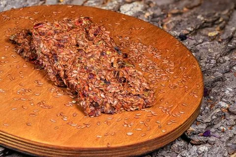 A rustic stack of seed bars or flats arranged on a circular wooden board, wit Stock Photos