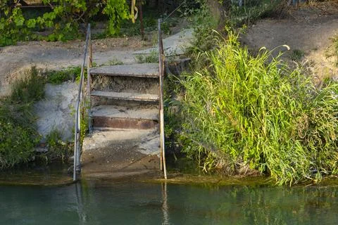 Rustic stairs to the river Stock Photos