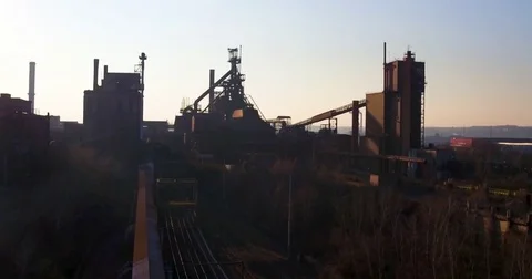Rustic steel factory at sunset Stock Footage 81534352