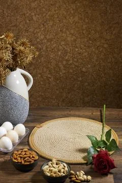 Rustic Still Life With Ceramic Vase, Golden Dried Flowers, Red Rose, Eggs and Nu Stock Photos
