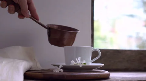 Rustic still life. female hand pours hot water from a copper bucket into the cup Stock Footage 67764685