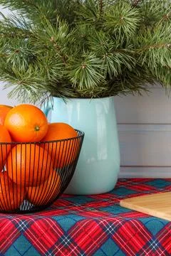 Rustic still life with pine branches and oranges on table Stock Photos