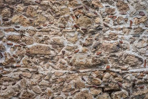 Rustic stone and brick wall texture with natural patterns 스톡 사진