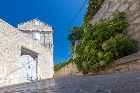 Rustic Stone Architecture With Blue Sky in Countryside Setting, Donje selo,.. Foto stock