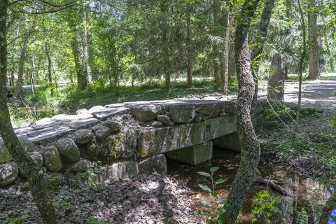 Rustic Stone Bridge in the Finnish Forest of Rascafra Stock Photos