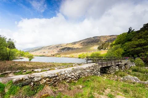 Rustic Stone Bridge Over Stream at Llynnau Mymbyr, Snowdonia National Park Stock Photos