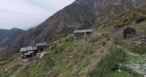 Rustic Stone Cabins on Mountainside Stock Footage 81001472