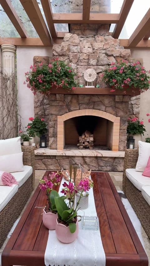 Rustic Stone Fireplace in Luxury Outdoor Gazebo With Floral Decor Stock Footage 334886414