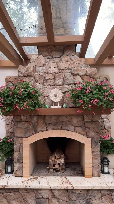 Rustic Stone Fireplace in Luxury Outdoor Gazebo With Floral Decor Vídeo Stock 334887156