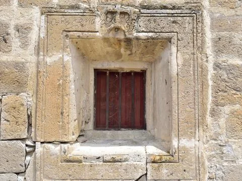 Rustic stone-framed window at San Lucas Evangelista church Stock Photos
