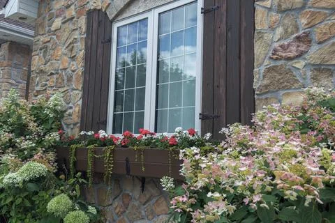 Rustic Stone House Window With Flowers Stock Photos