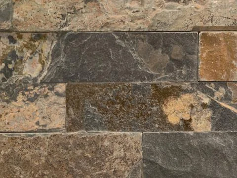 Rustic stone with mineral patterns, natural mosaic featuring irregular mineral Stock Photos