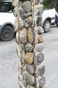 Rustic Stone Pillar in Street Setting Stock Photos