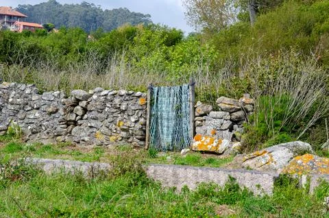 Rustic Stone Wall with Homemade Gate in Rural Countryside Landscape Stock Photos