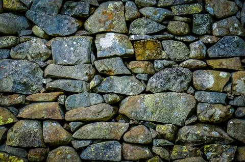 Rustic stone wall texture Stock Photos