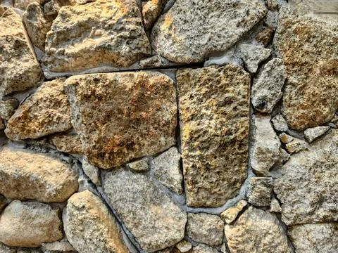 Rustic stone wall texture Stock Photos