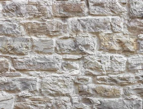 Rustic stone wall Texture of wall. Old wall made from bumpy stones. Copyri... Stock Photos