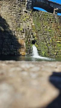 Rustic Stone Wall with Waterfall Stock Photos