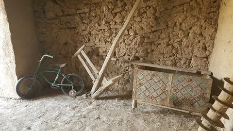 A rustic storage area with traditional tools, reflecting stock photo. 写真素材